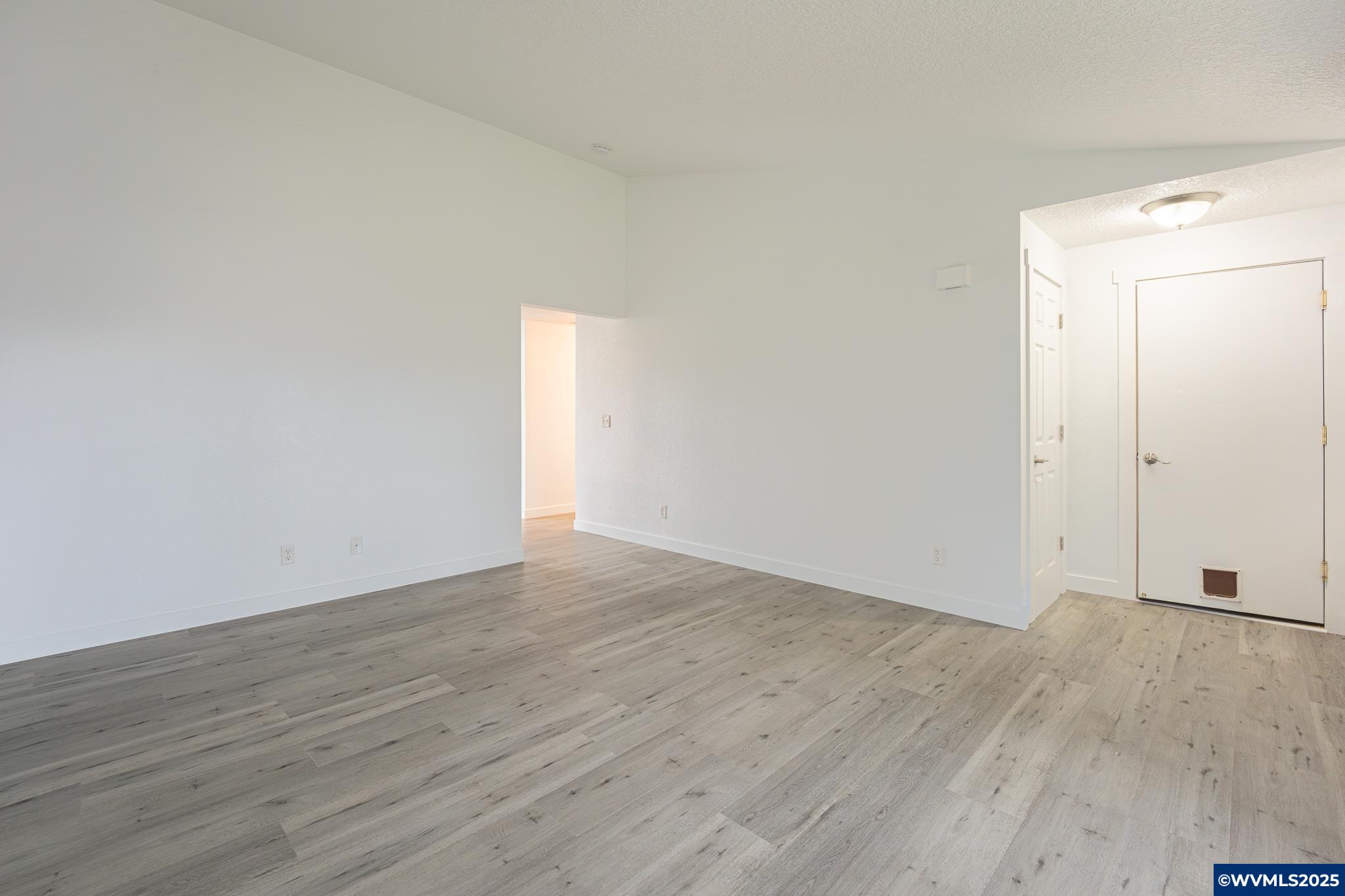 1467 South 7th Street Independence, OR 97351 - Photo 6 of 31 a view of an empty room with wooden floor