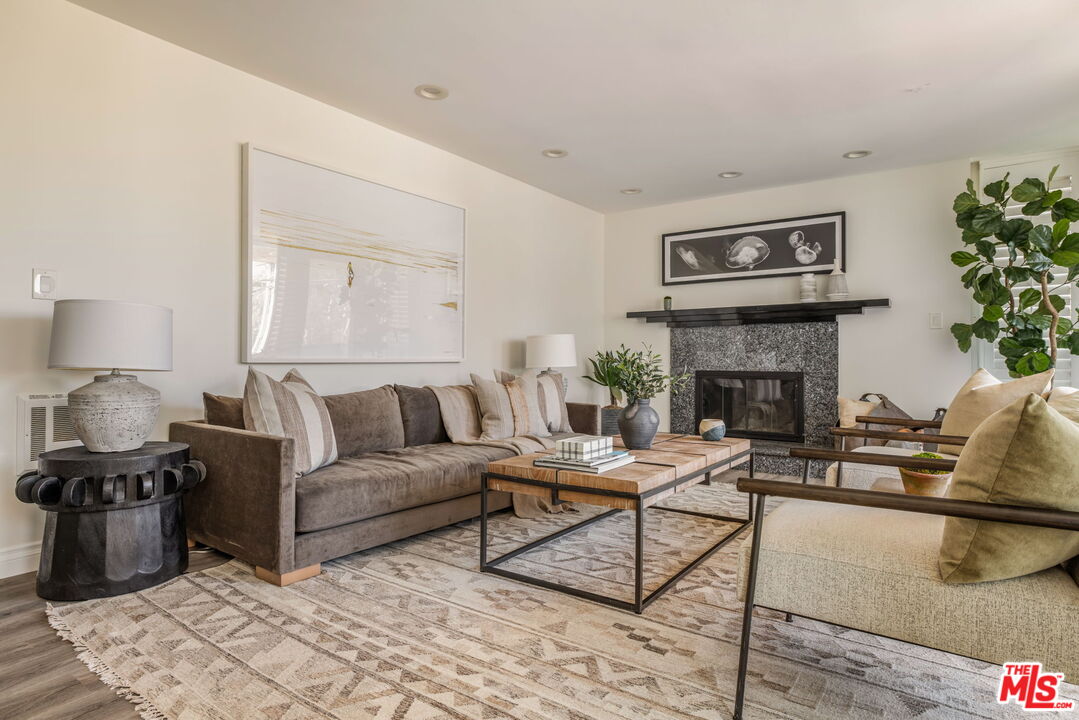 30 Driftwood Street, Unit 4 Marina del Rey, CA 90292 - Photo 4 of 19 a living room with furniture and a fireplace