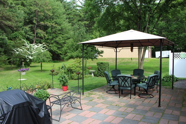21 Mulpus Road Lunenburg, MA 01462 - Photo 15 of 24 a view of a table and chairs under an umbrella