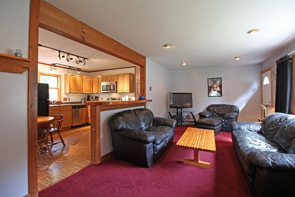 21 Mulpus Road Lunenburg, MA 01462 - Photo 5 of 24 a living room with furniture and a flat screen tv