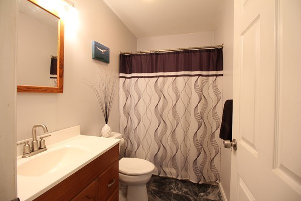 21 Mulpus Road Lunenburg, MA 01462 - Photo 10 of 24 a bathroom with a sink toilet and shower