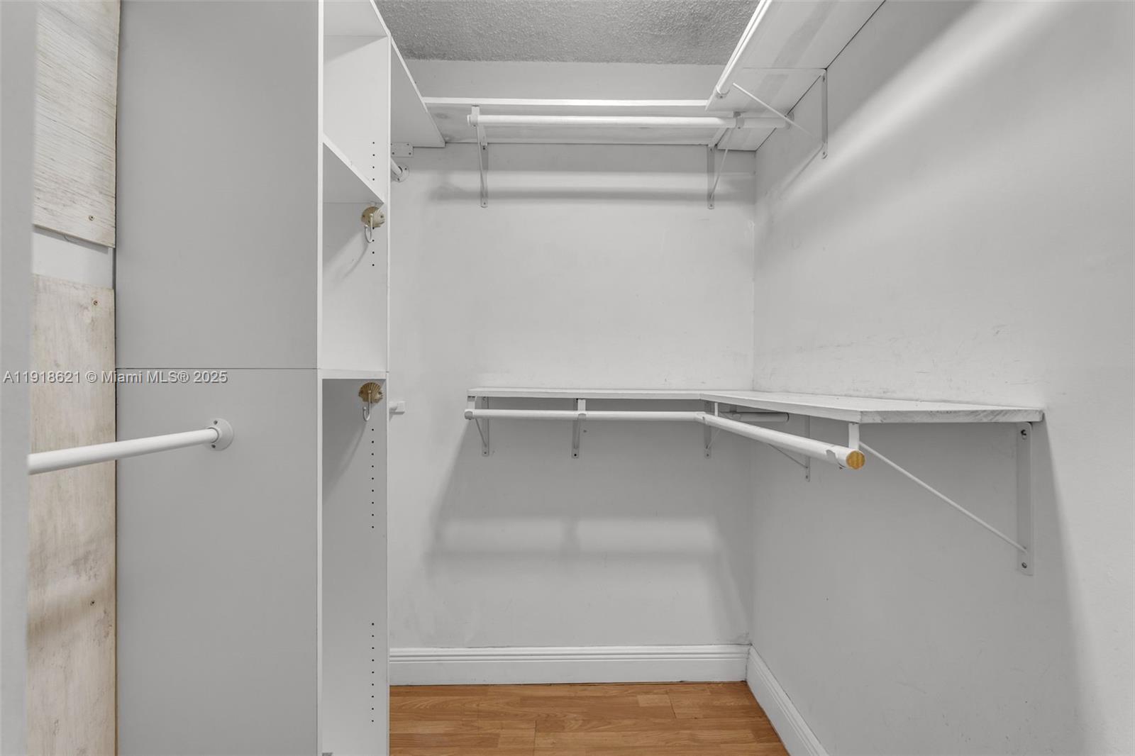 401 Northwest 107th Avenue, Unit 107 Miami, FL 33172 - Photo 18 of 31 a view of an empty walk in closet