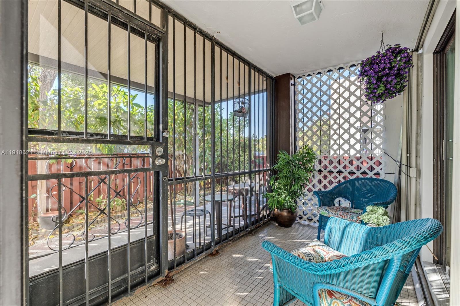 401 Northwest 107th Avenue, Unit 107 Miami, FL 33172 - Photo 22 of 31 a living room filled with furniture and a potted plant