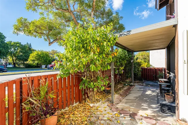 a view of a porch with a small yard