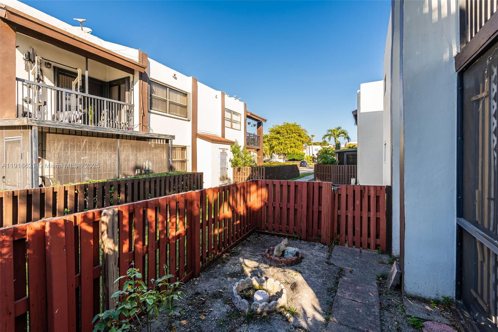401 Northwest 107th Avenue, Unit 107 Miami, FL 33172 - Photo 26 of 31 a view of a porch with a small yard