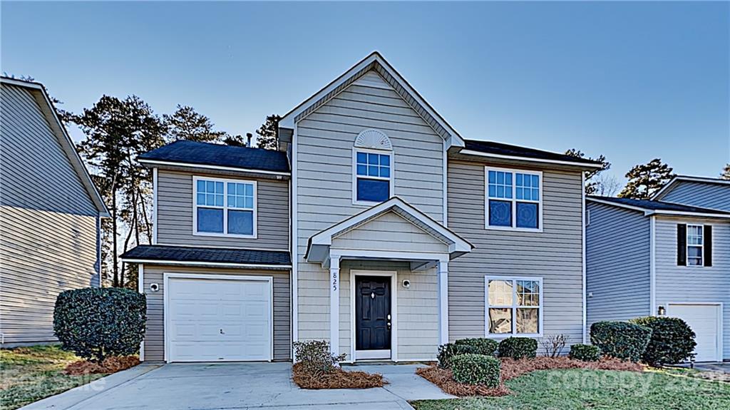 825 Raindrops Road Gastonia, NC 28054 - Photo 1 of 23 a front view of a house with a yard