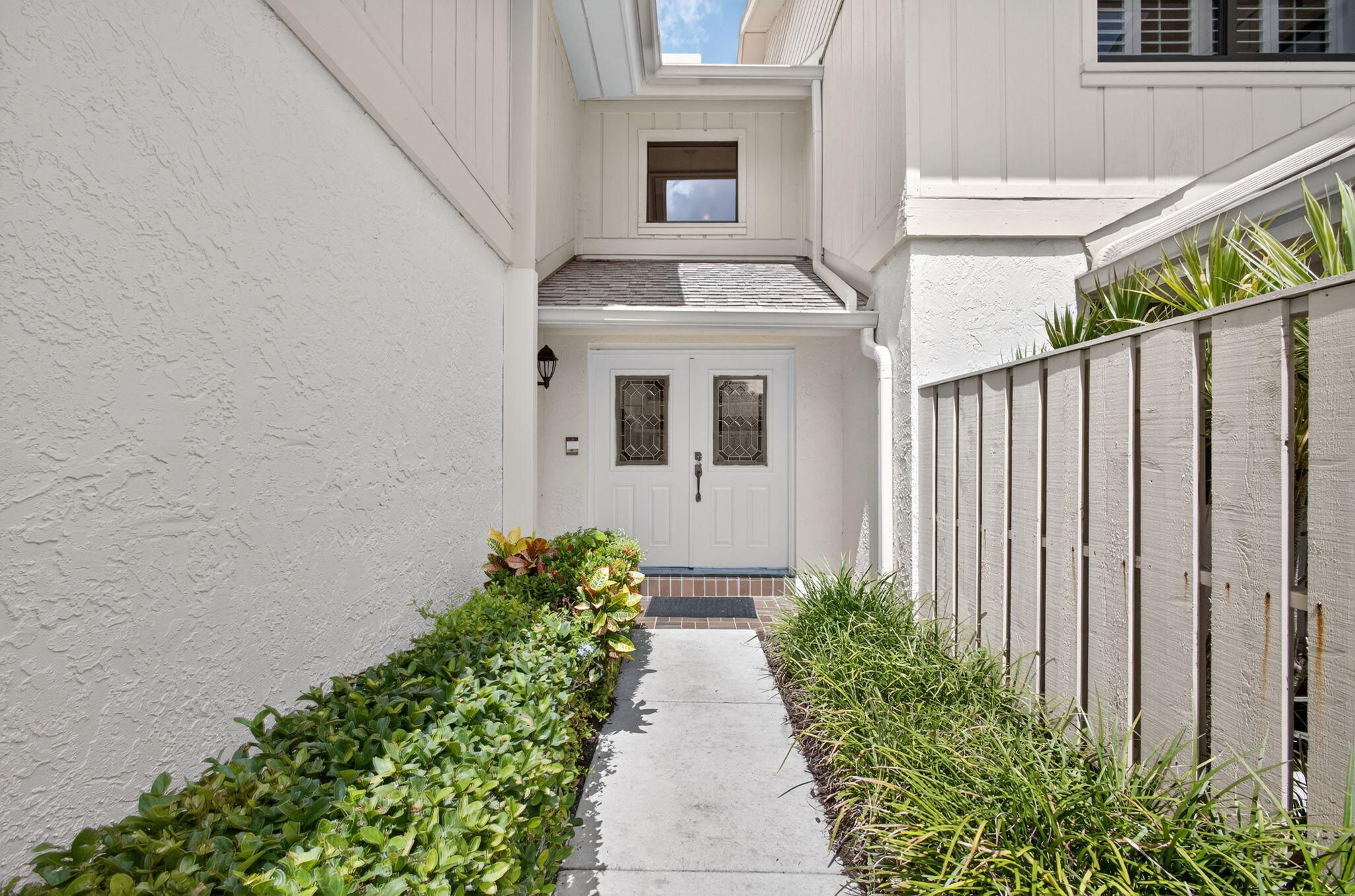 16942 Waterbend Drive, Unit 258 Jupiter, FL 33477 - Photo 1 of 33 a front view of a house with a yard