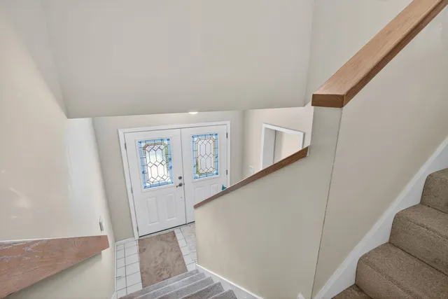a view of entryway with wooden floor
