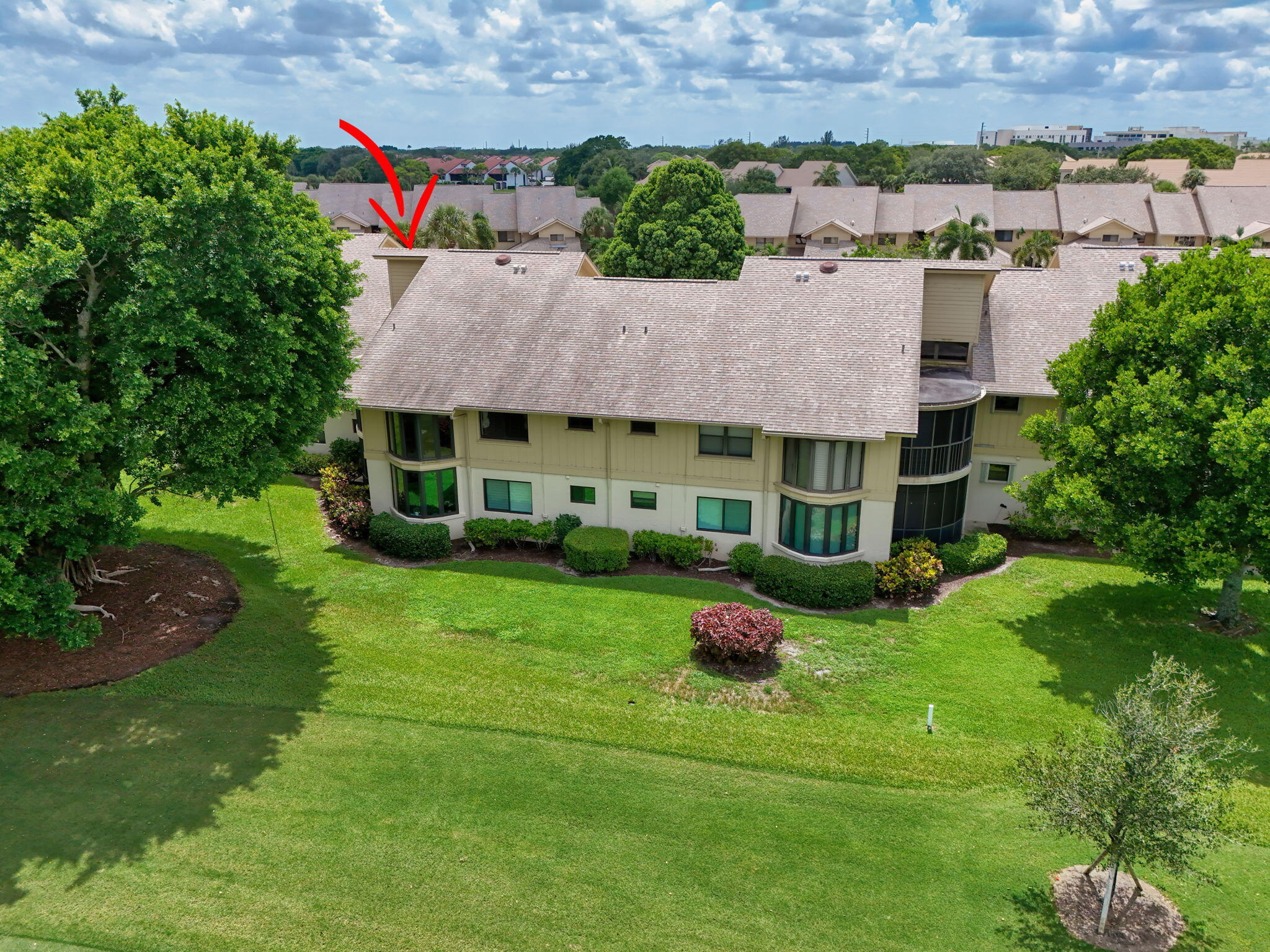 16942 Waterbend Drive, Unit 258 Jupiter, FL 33477 - Photo 25 of 33 a aerial view of a house with swimming pool and a yard