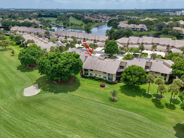 an aerial view of a house with yard