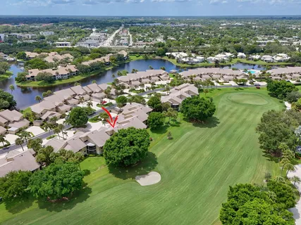 an aerial view of lake residential houses with outdoor space and trees