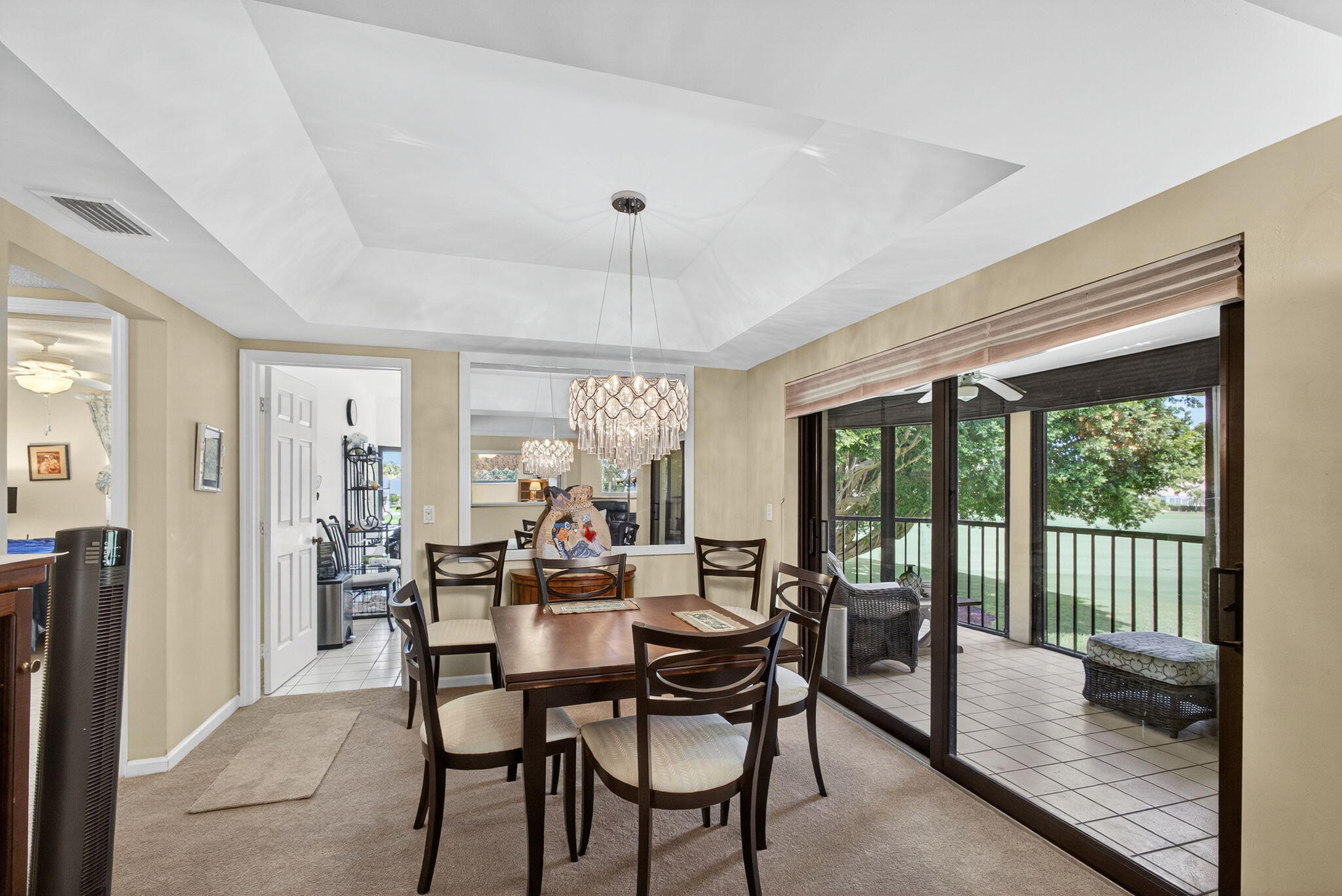 16942 Waterbend Drive, Unit 258 Jupiter, FL 33477 - Photo 6 of 33 a view of a dining room with furniture large windows and wooden floor