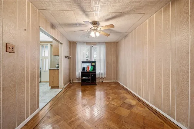 a view of an empty room with a ceiling fan