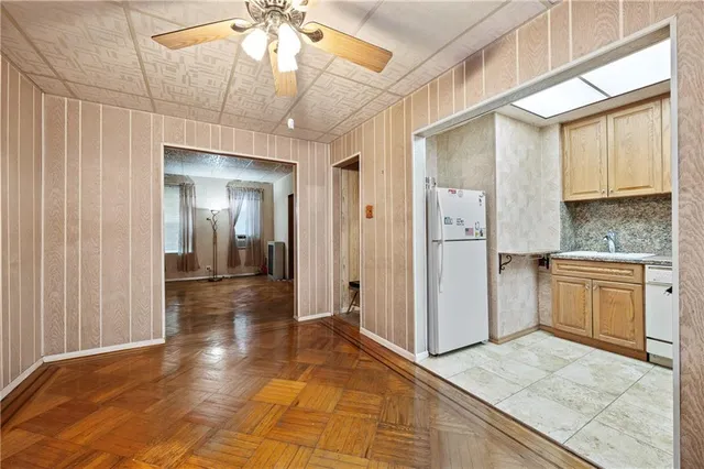 a view of a kitchen from a hallway