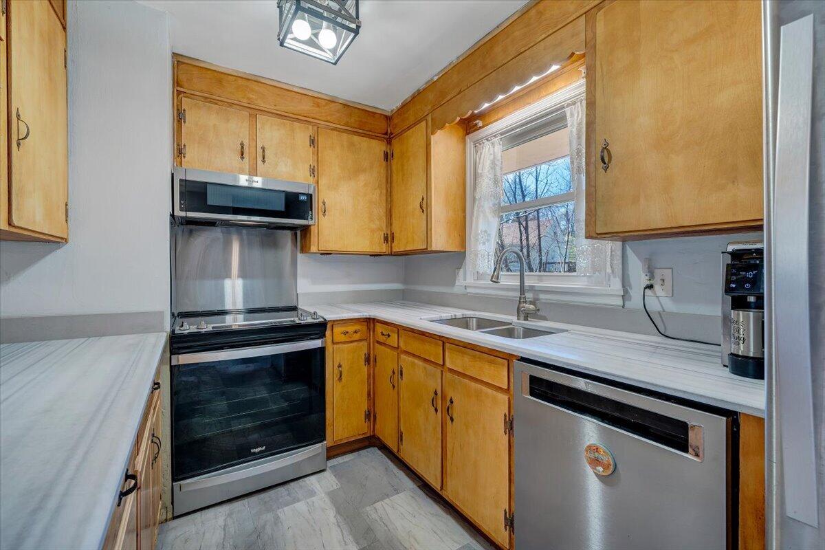 2129 Twelve Oclock Knob Road Salem, VA 24153 - Photo 12 of 48 a kitchen with a sink stove and cabinets