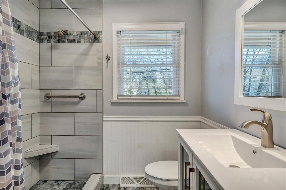 2129 Twelve Oclock Knob Road Salem, VA 24153 - Photo 15 of 48 a bathroom with a sink toilet and shower