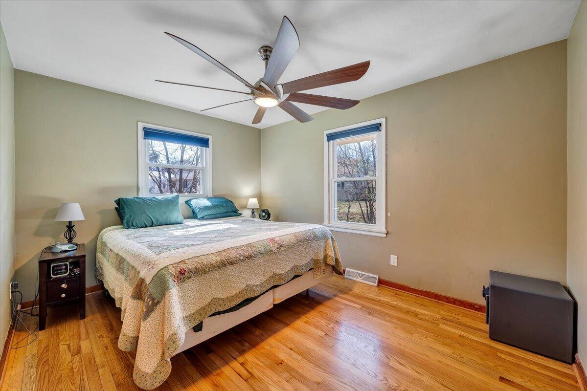 2129 Twelve Oclock Knob Road Salem, VA 24153 - Photo 17 of 48 a bedroom with a bed and wooden floor