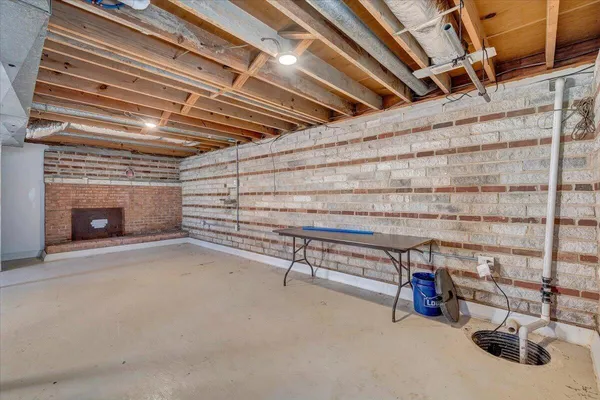 a view of an empty room with a fireplace