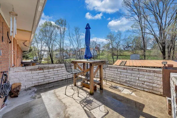 a view of a house with wooden fence