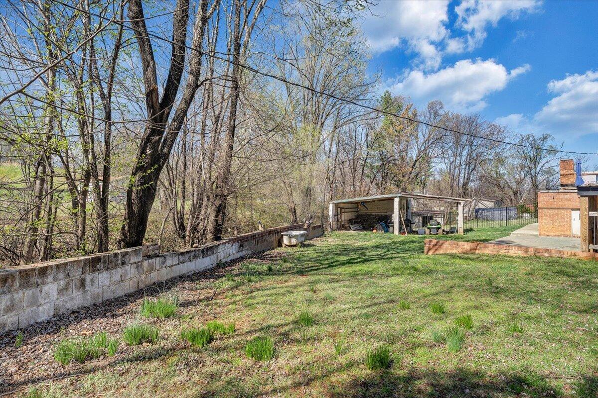 2129 Twelve Oclock Knob Road Salem, VA 24153 - Photo 41 of 48 a backyard of a house with table and chairs