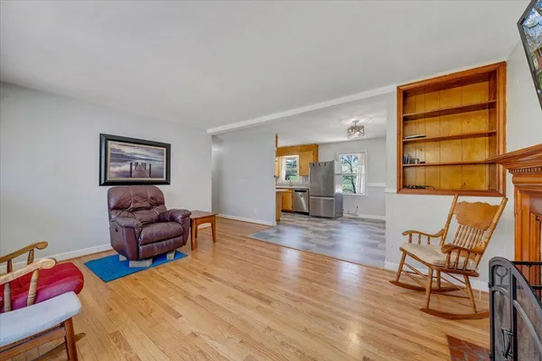 a bedroom with furniture and wooden floor