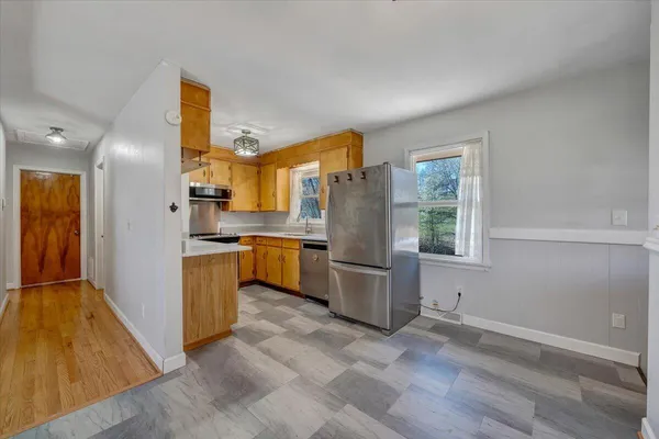 a kitchen with a refrigerator and countertop