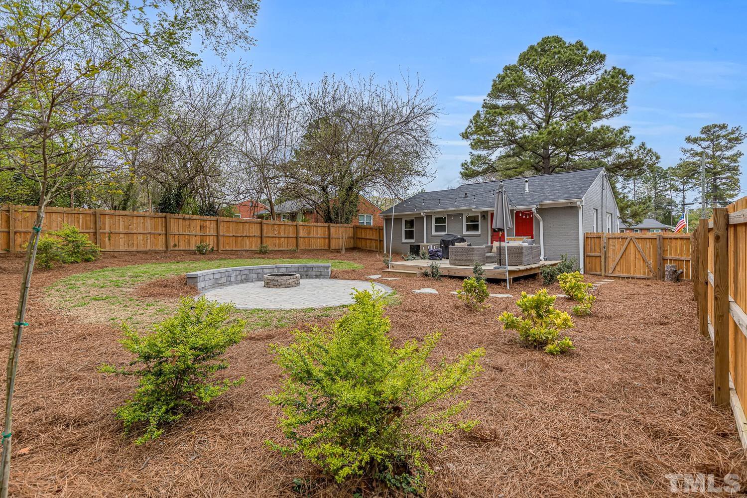 2456 Milburnie Road Raleigh, NC 27610 - Photo 20 of 23 a swimming pool view with a outdoor seating