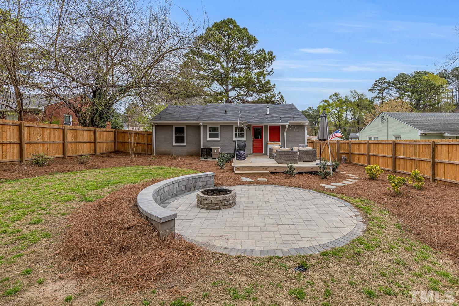 2456 Milburnie Road Raleigh, NC 27610 - Photo 22 of 23 a view of a house with backyard porch and sitting area