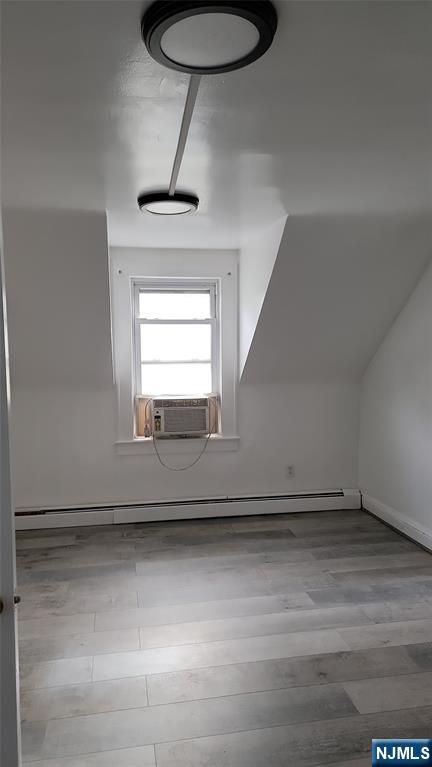 165 Main Street, Unit SECOND Garfield, NJ 07026 - Photo 11 of 12 a view of empty room with wooden floor and fan