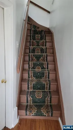 a kitchen with white cabinets and a sink