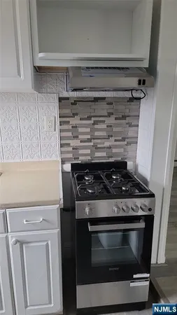 a white refrigerator freezer and a dishwasher in a kitchen