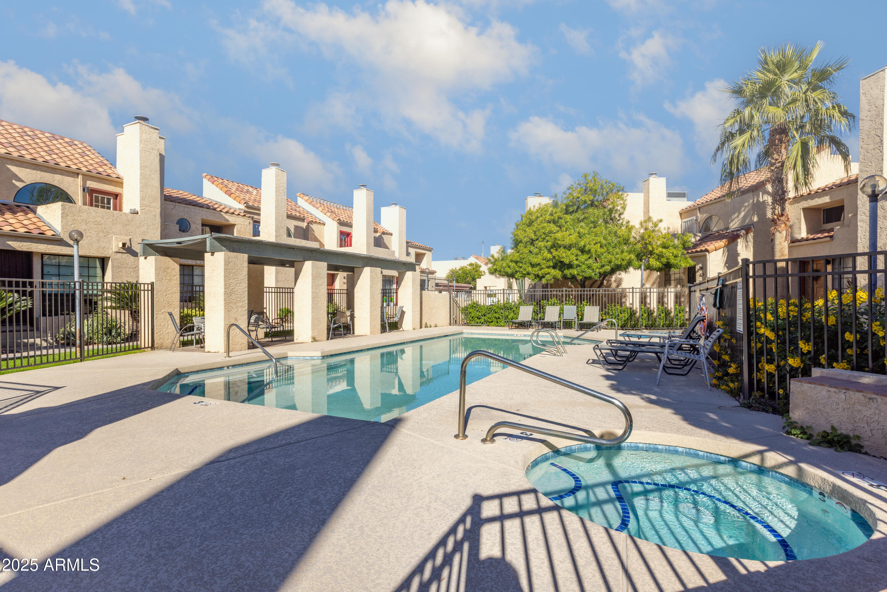 1025 East Highland Avenue, Unit 30 Phoenix, AZ 85014 - Photo 19 of 20 a view of a swimming pool with a patio