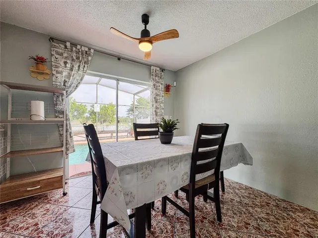 a view of a dining room with furniture window and outside view