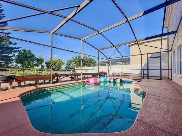 a view of a backyard with sitting area