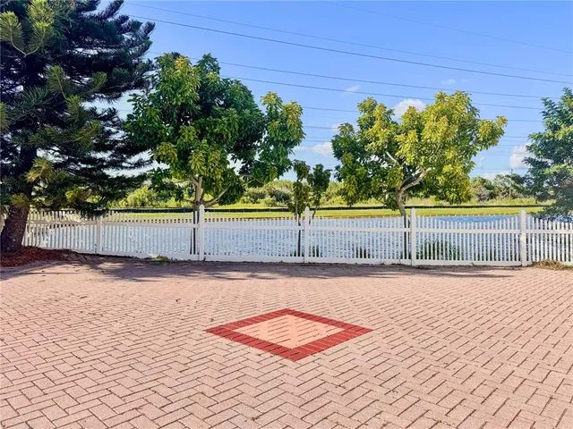 a view of a swimming pool with an outdoor space and seating area