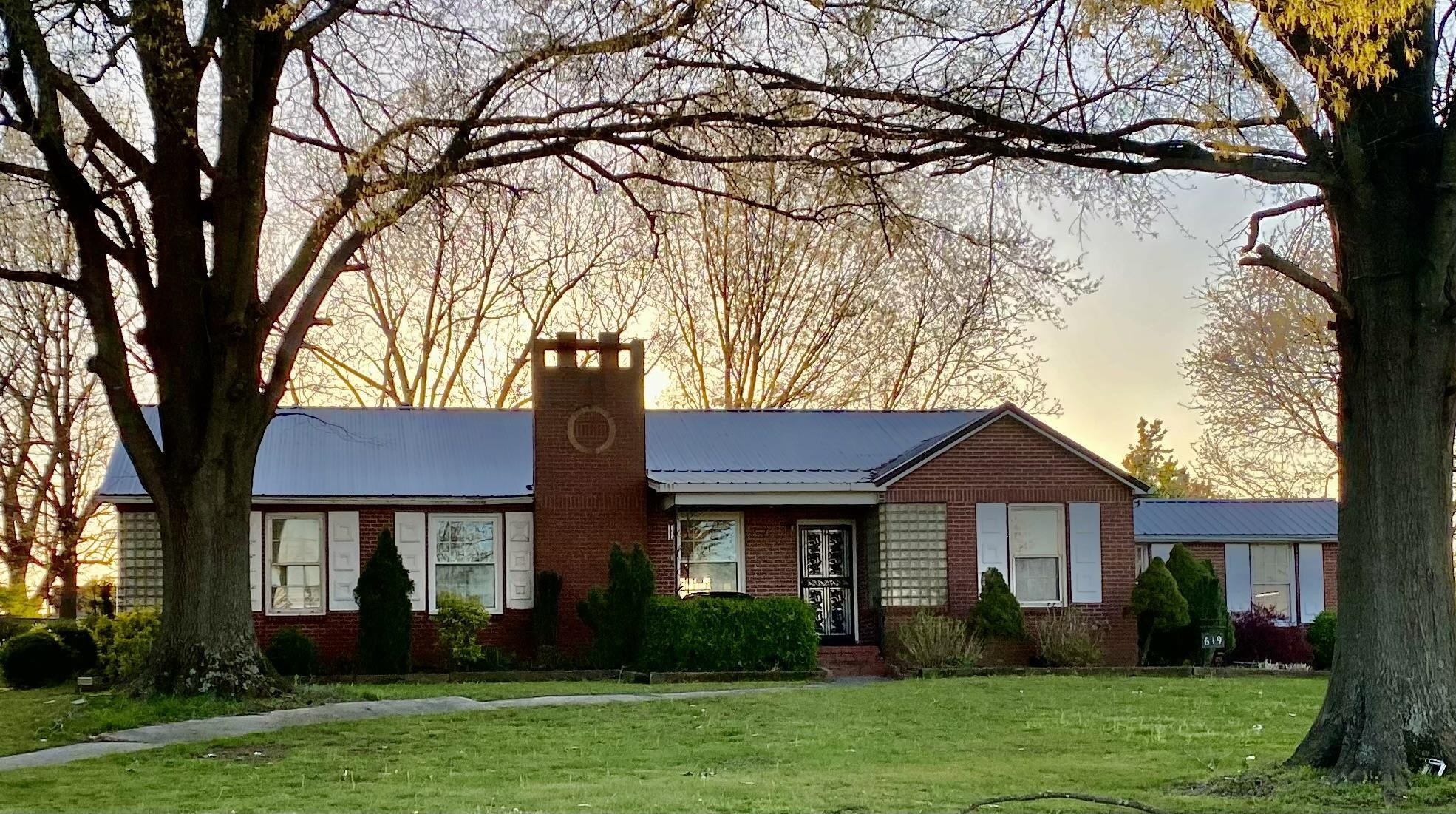 619 South Trenton Street Rutherford, TN 38369 - Photo 1 of 22 a front view of a house with a garden