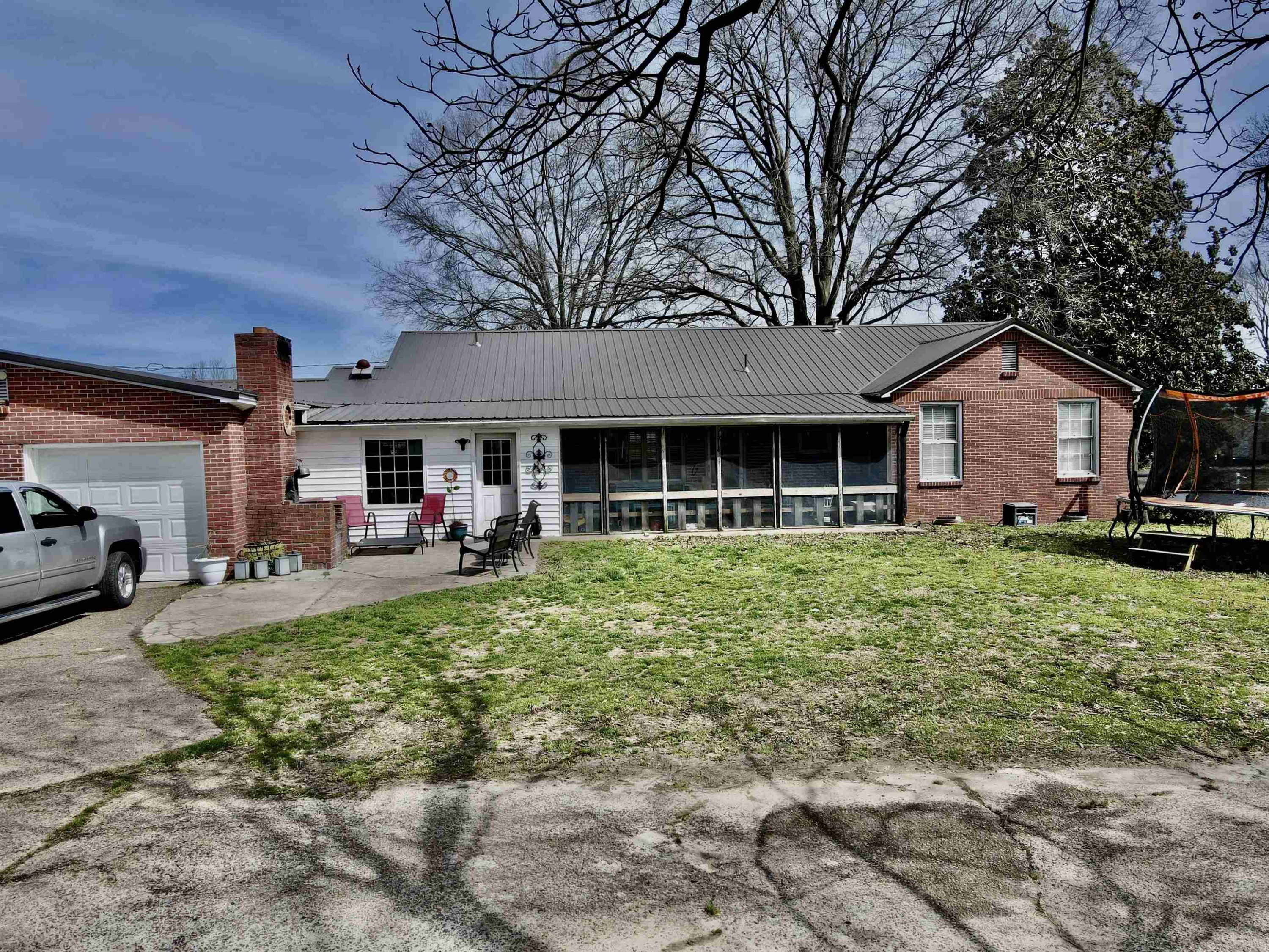 619 South Trenton Street Rutherford, TN 38369 - Photo 21 of 22 a front view of a house with a yard porch and furniture