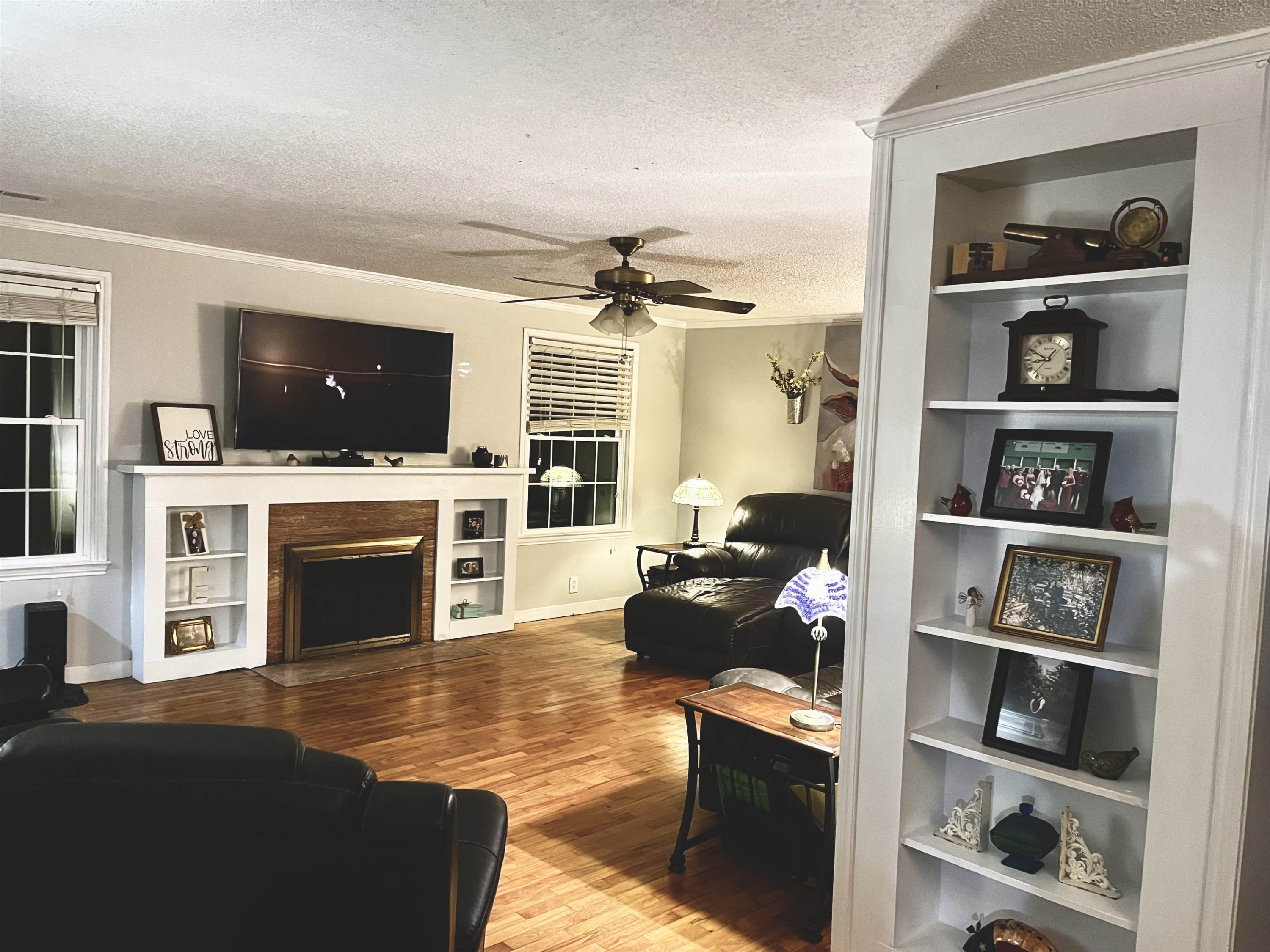 619 South Trenton Street Rutherford, TN 38369 - Photo 3 of 22 a living room with fireplace furniture and a flat screen tv