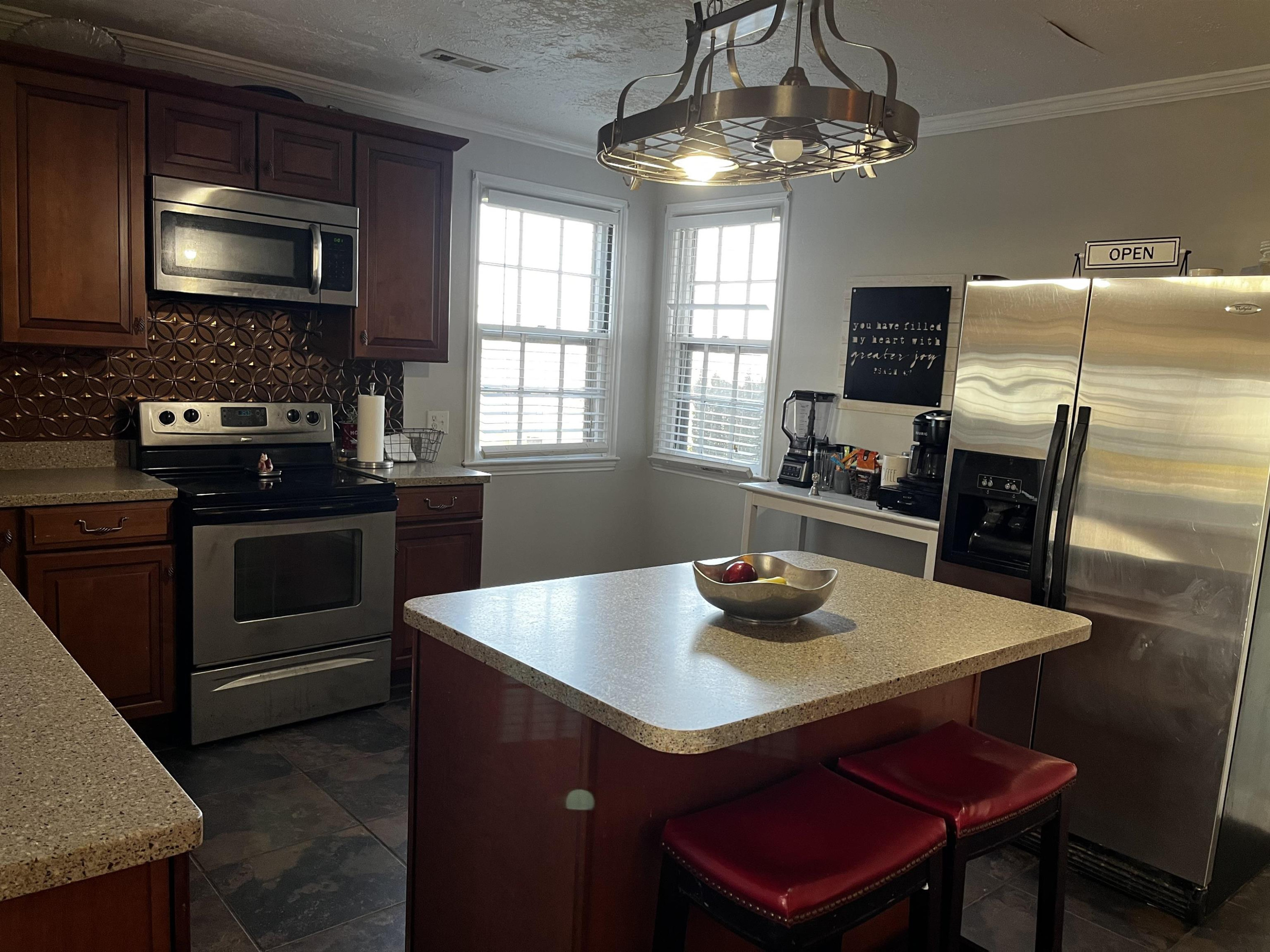 619 South Trenton Street Rutherford, TN 38369 - Photo 7 of 22 a kitchen with stainless steel appliances a dining table and chairs