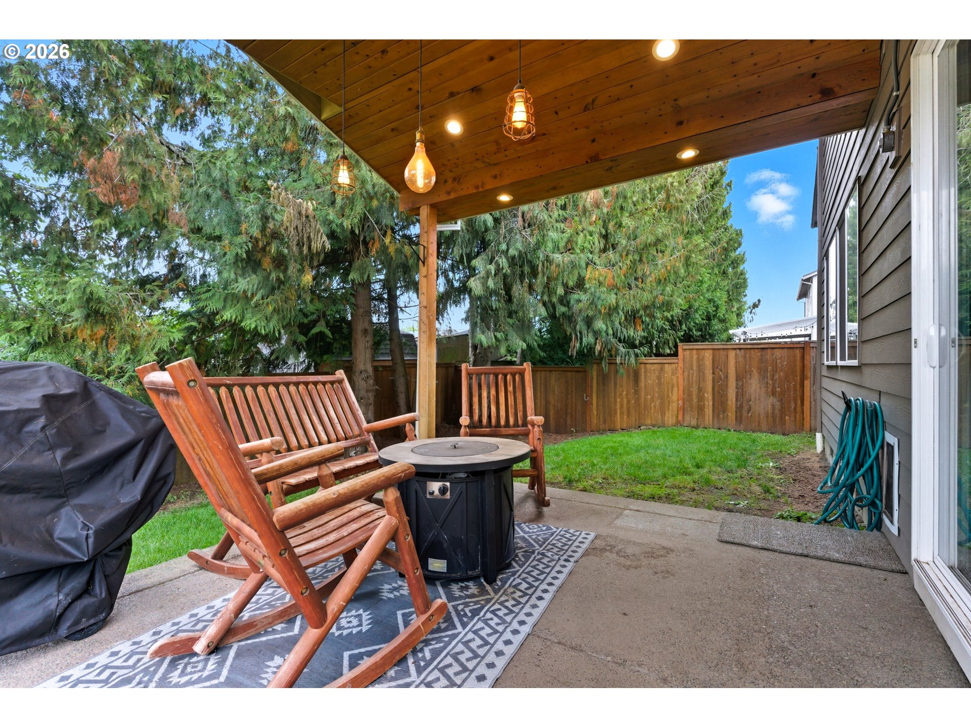 476 Southwest 15th Avenue Canby, OR 97013 - Photo 35 of 41 a view of a patio with a table and chairs