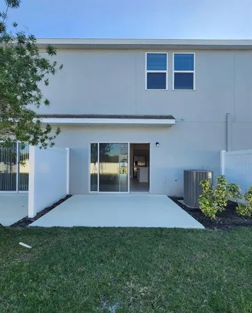 a view of an house with backyard space and garden