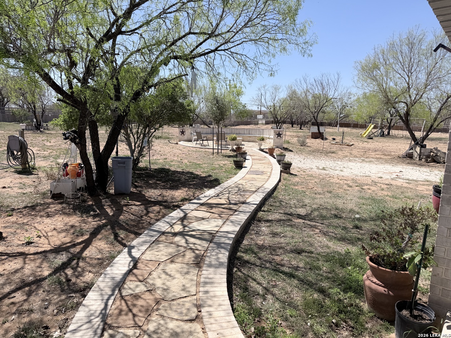 152 County Roads 2667 Devine, TX 78016 - Photo 12 of 51 a view of a backyard of the house