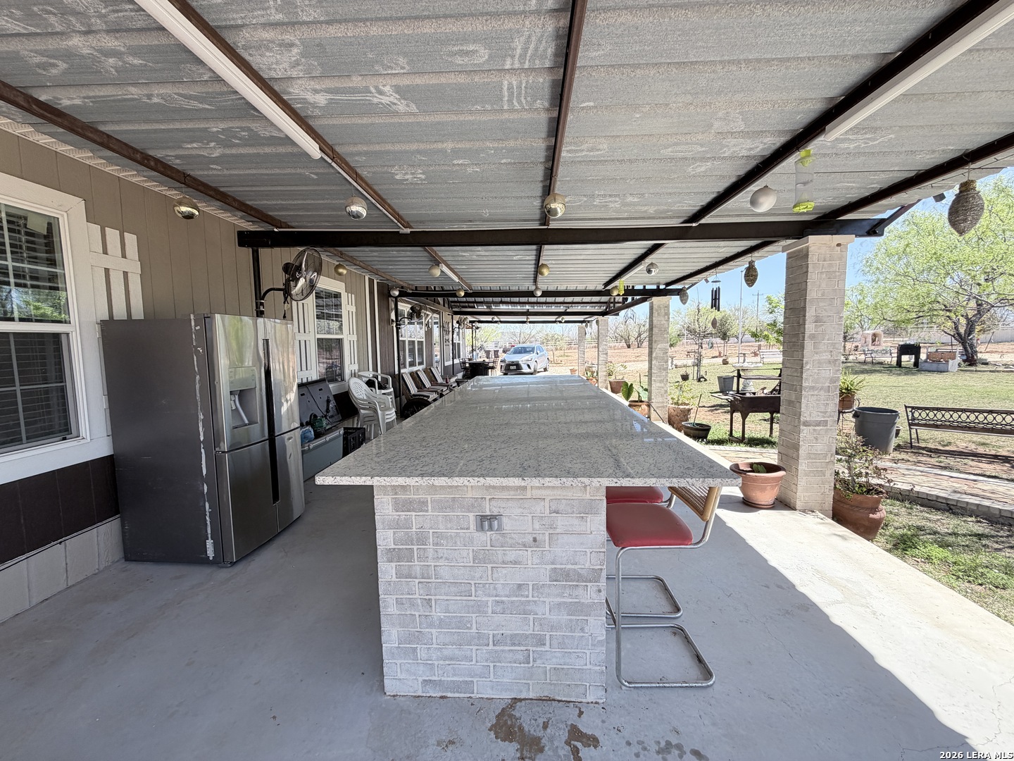 152 County Roads 2667 Devine, TX 78016 - Photo 15 of 51 a view of a storage room with a sink and dishwasher