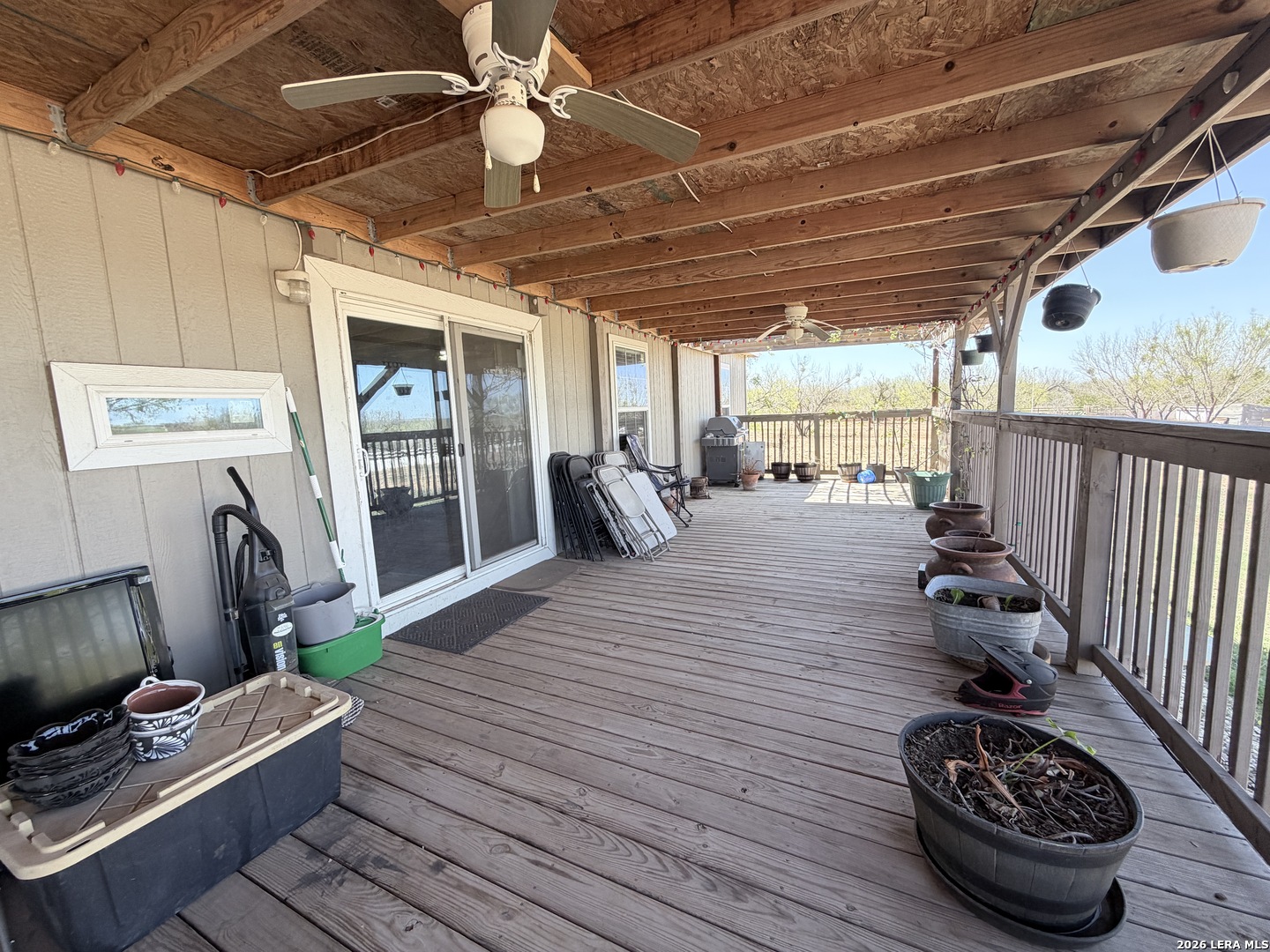 152 County Roads 2667 Devine, TX 78016 - Photo 18 of 51 a room with wooden floor and furniture