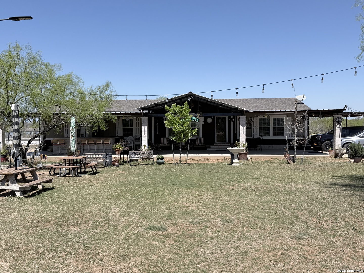152 County Roads 2667 Devine, TX 78016 - Photo 2 of 51 a view of a chairs and tables in the patio