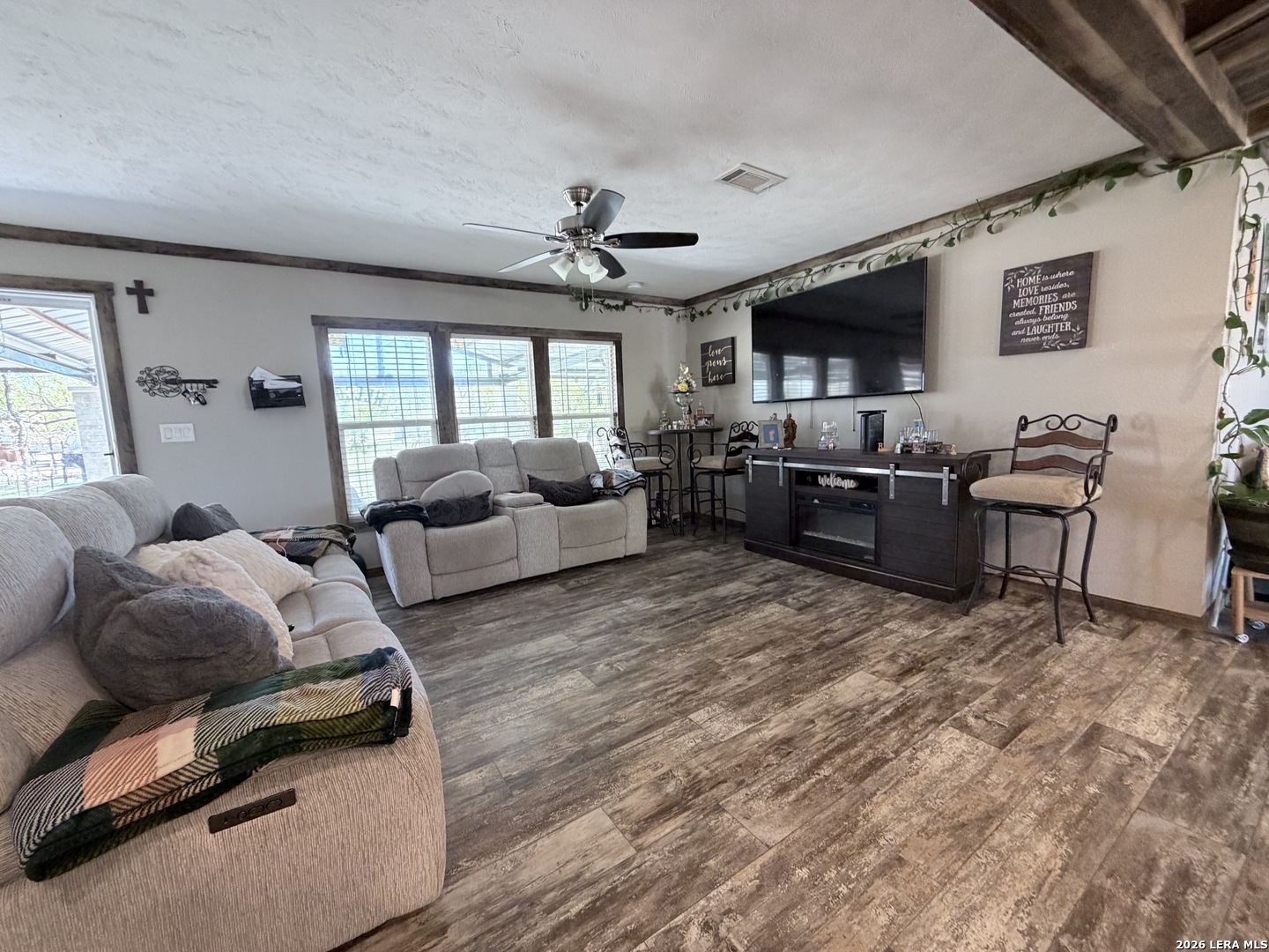 152 County Roads 2667 Devine, TX 78016 - Photo 22 of 51 a living room with furniture flat screen tv and windows