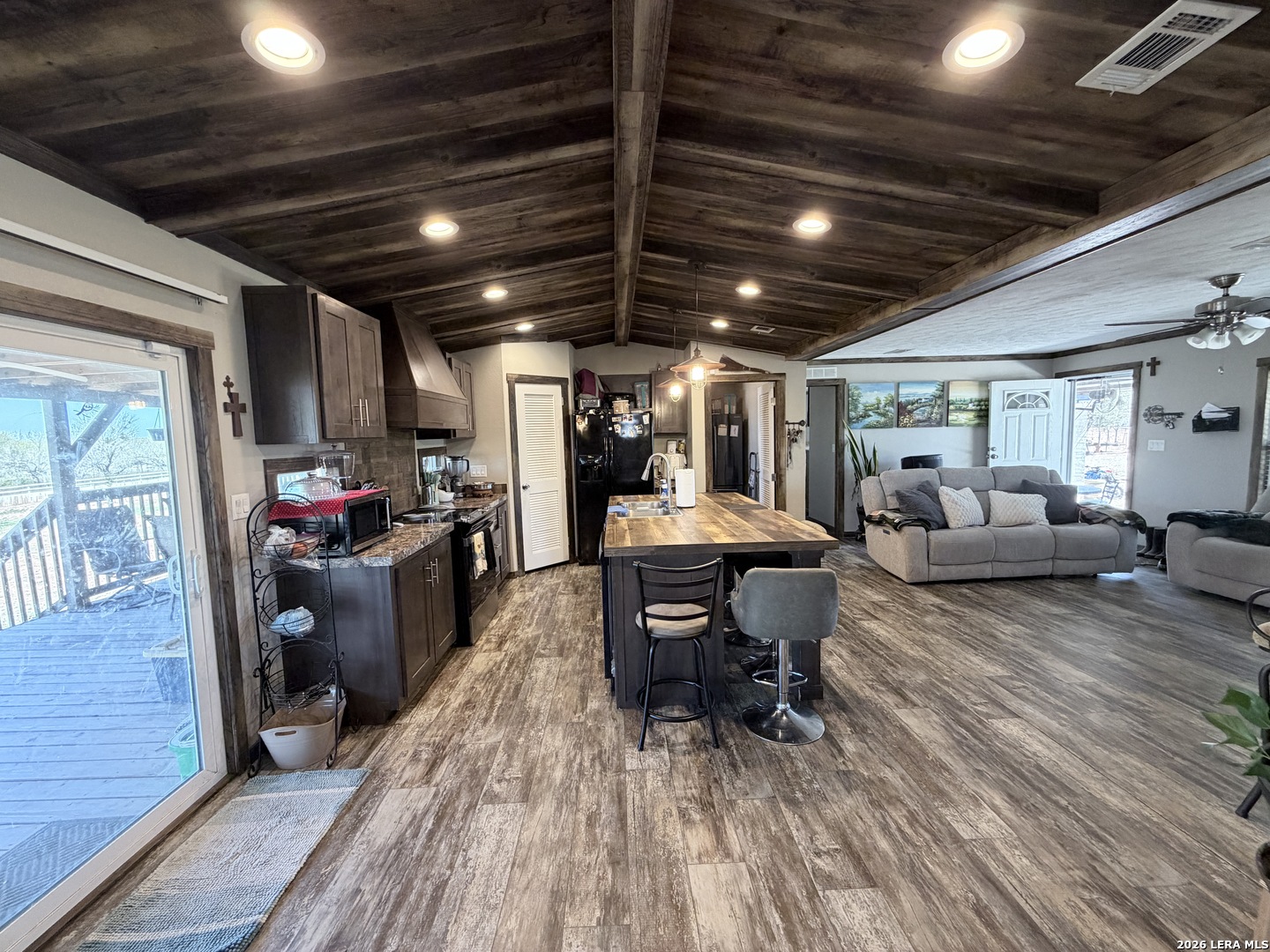 152 County Roads 2667 Devine, TX 78016 - Photo 26 of 51 a living room with furniture and a wooden floor