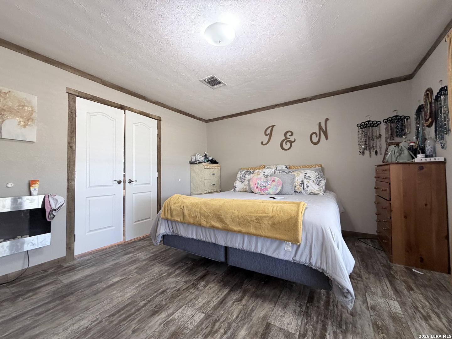 152 County Roads 2667 Devine, TX 78016 - Photo 32 of 51 a bedroom with a bed and a large window