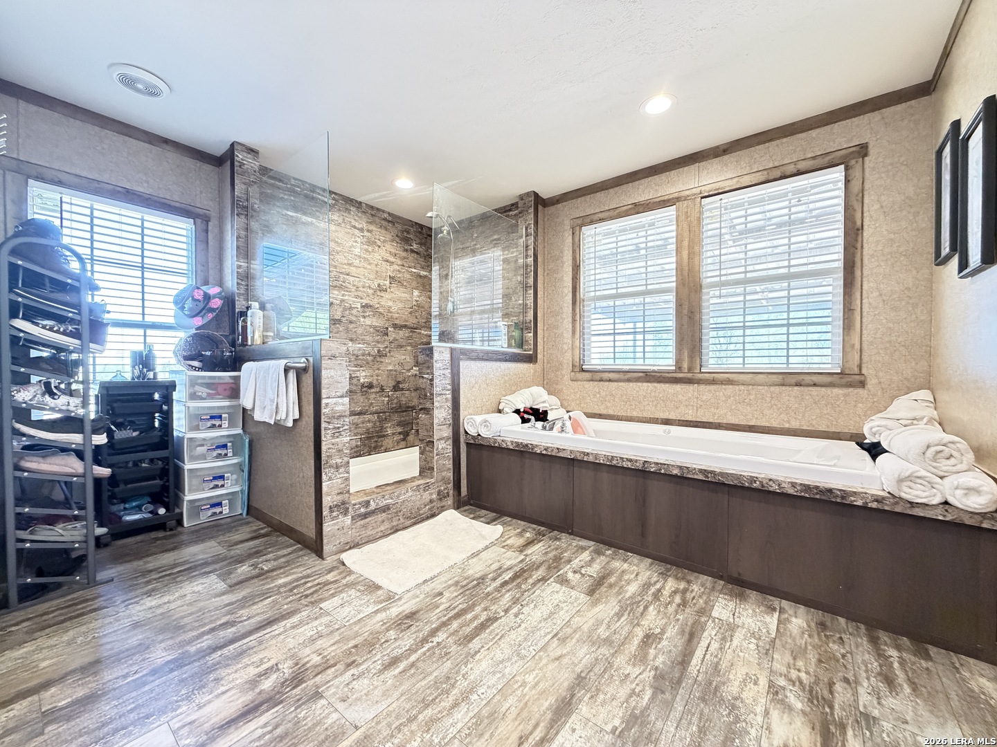 152 County Roads 2667 Devine, TX 78016 - Photo 34 of 51 a spacious bathroom with a tub and a large window