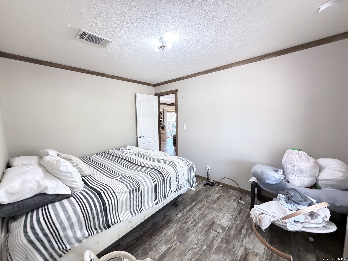 152 County Roads 2667 Devine, TX 78016 - Photo 42 of 51 a bedroom with a bed and a window